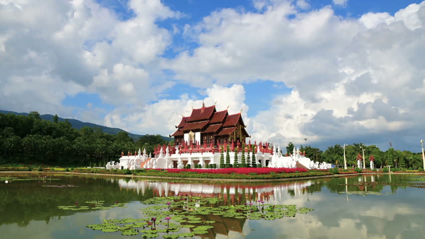 Time Lapse of Beautiful Horkumluang Castle of Rajapruek park with clouds and lotus flower in pool at Chiang Mai Thailand 