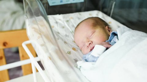 Newborn Baby Boy Sleeps Hospital Bassinet Stock Footage Video (100%
