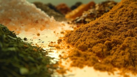 Fragrant, aromatic, natural and good for health, spices lie on the table, separately from each other.The camera moves through the spices. Closeup. Dolly shot. Shallow depth of field