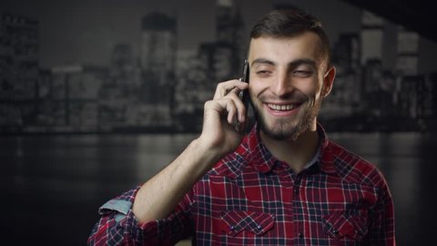Young Attractive Lumbersexual Man Talking by Phone