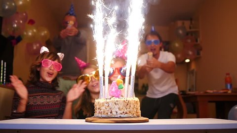 Cheering people birthday party - firework candles cake, colorful streamers confetti fly