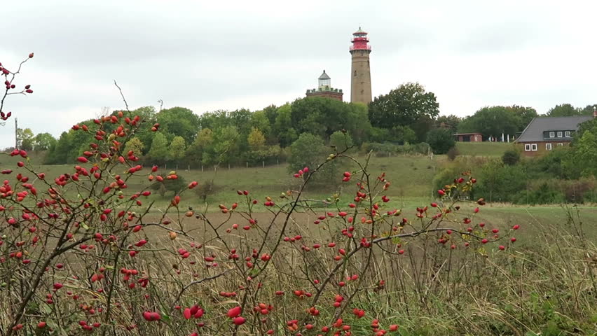 Lighthouse of Cape Arkona at Putgarten. Fields and meadow around. Autumn leave. Baltic sea coast. (Mecklenburg-Vorpommern, Germany). Stormy weather.