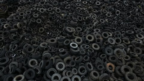 Aerial view old rubber, tyre tire, wheel of cars in recycling factory 4k