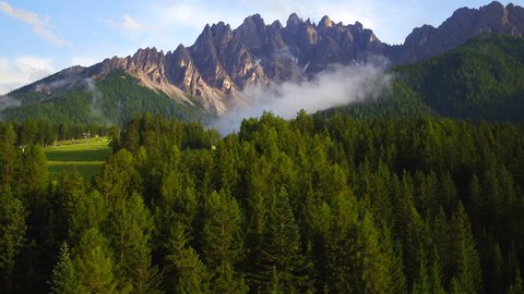 Mountain view , a suggestive aerial video in mountain over a forest in a beautiful summer day, dolomiti