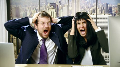 Furious business man and woman shouting in office slow motion
