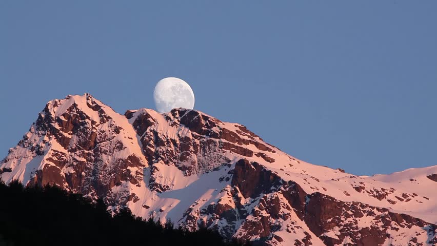 The moon falling over snow mountain peak name Mount Bonpland in Glenorchy, Queenstown, New Zealand
