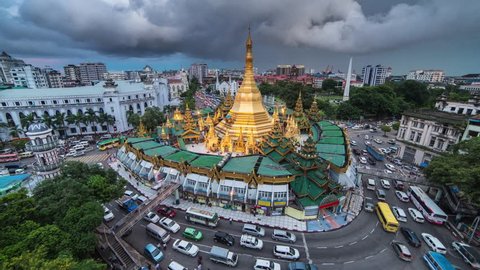 4K day to night time-lapse view of Sule Pagoda with traffic, a major landmark in Yangon, Myanmar