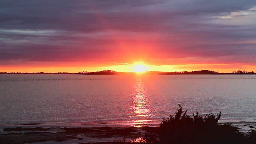 The sun sets over the Edisto River located the St Helena sound in South Carolina with a vivid, colorful display.  This was the day after Tropical Storm Julia