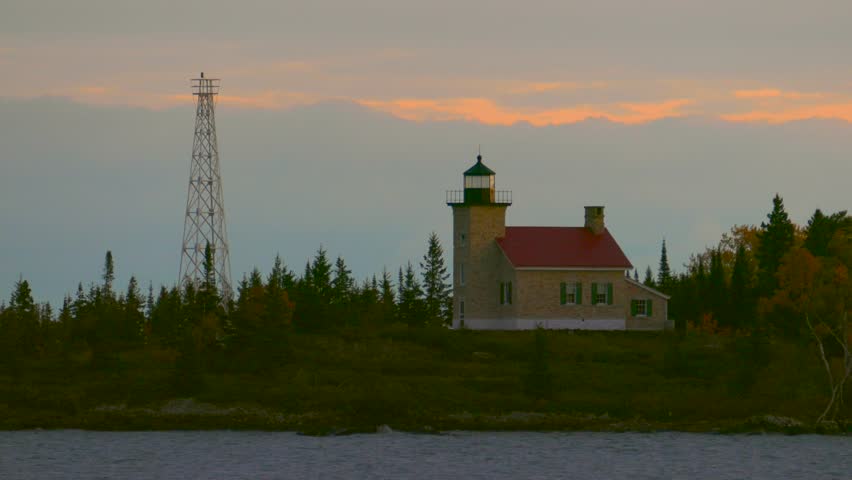 Scenic Copper Harbor Michigan lighthouse with Autumn colors, at dawn.
