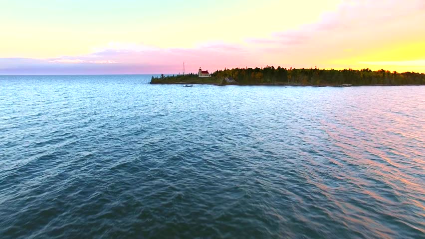 Scenic Copper Harbor Michigan lighthouse with Autumn colors, at dawn, aerial view.
