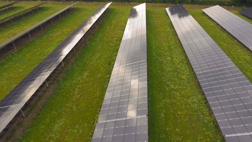 Green energy - rows of solar panels pan shot. Aerial video | Shutterstock HD Video #20724730