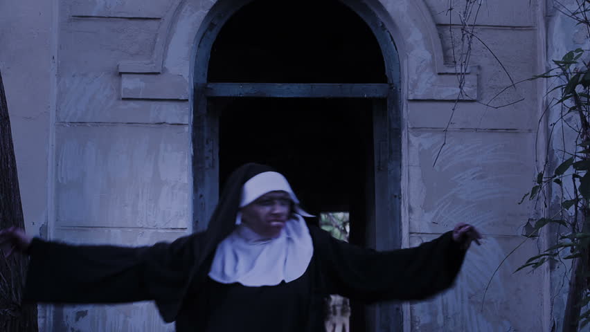 Zombie nun. devilish woman in nun costume walking around the temple. halloween | Shutterstock HD Video #20726266