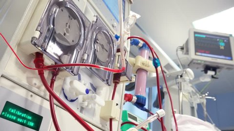 Dialysis Medical Device Performing Procedure with monitor on background