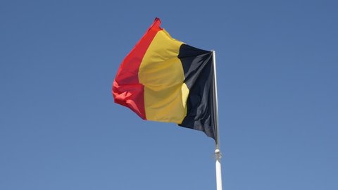 Slow motion Belgium flag against tricolour stripes blue sky waving on wind 1920X1080 HD footage - Shiny fabric on Belgian national symbol slow-mo 1080p FullHD video