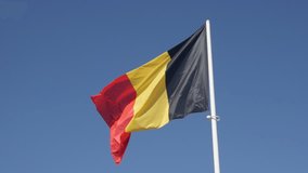 Shiny fabric on Belgian national symbol slow-mo 1920X1080 HD footage - Slow motion Belgium flag against tricolour stripes blue sky waving on wind 1080p FullHD video