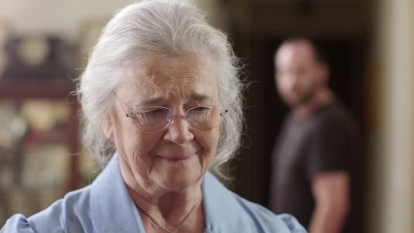A senior woman who is a victim of elder abuse is in fear while an abusive man glares at her. Shot in 4K UHD. | Shutterstock HD Video #20748130