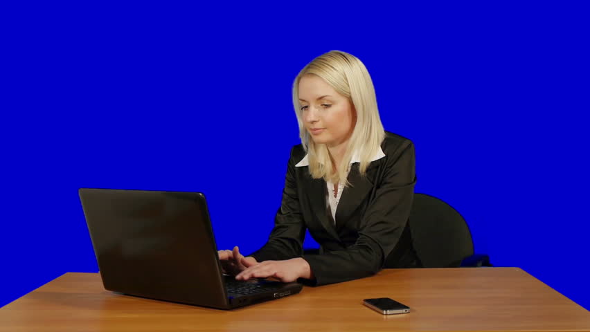 young businesswoman work with computer and answer the phone