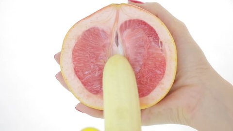 concept of sex. grapefruit and banana. close-up