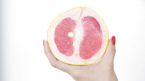 imitation sex. masturbation concept. woman fondles grapefruit. vagina