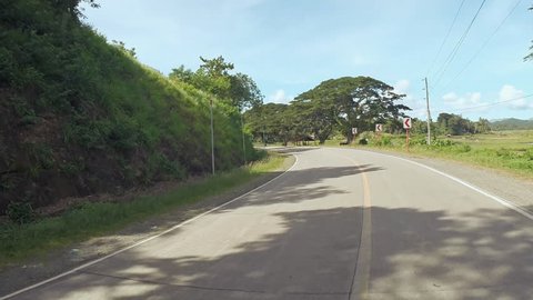 Village Road. Motion on motorbike. Philippines. Bohol island. Driving forward.