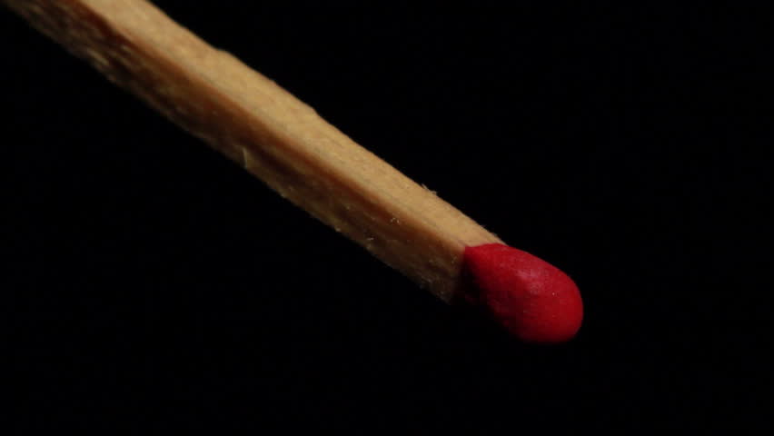 Close up of a match spontaneously lighting up in slow motion