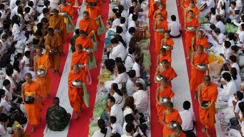 BANGKOK - MARCH 17: Monks are participating in a Mass Alms Giving of 12,600
