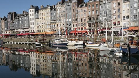 HONFLEUR, FRANCE - SEPTEMBER 2016: Beautiful Northern Normandy and The Vieux Bassin with port water reflections of buildings by the day footage