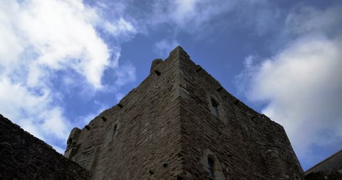 time-lapse of clouds passing over scottish castle tower battlements