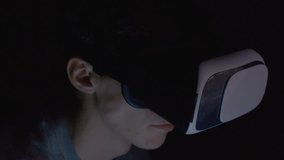 Closeup of man using virtual reality headset VR mask