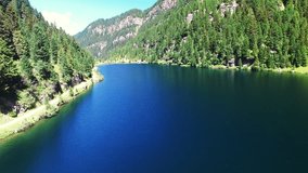 Mountain lake, a suggestive aerial video over a lake in mountain in a beautiful summer day