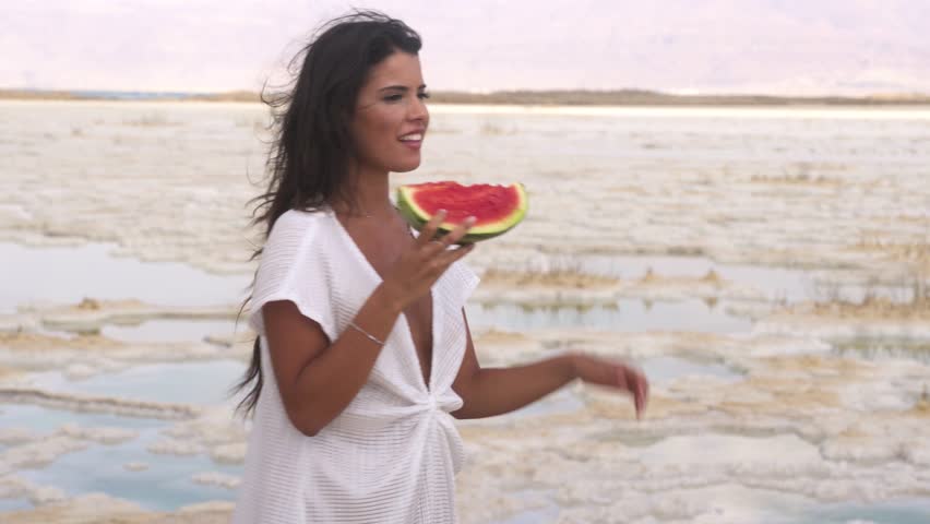 Pretty sexy girl eating watermelon