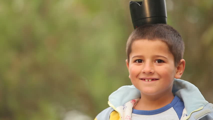 boy play with a camera Lens hood