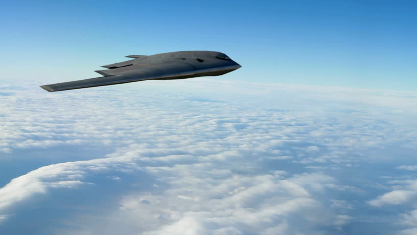 A B-2 Spirit Stealth Bomber flying at high altitude. 