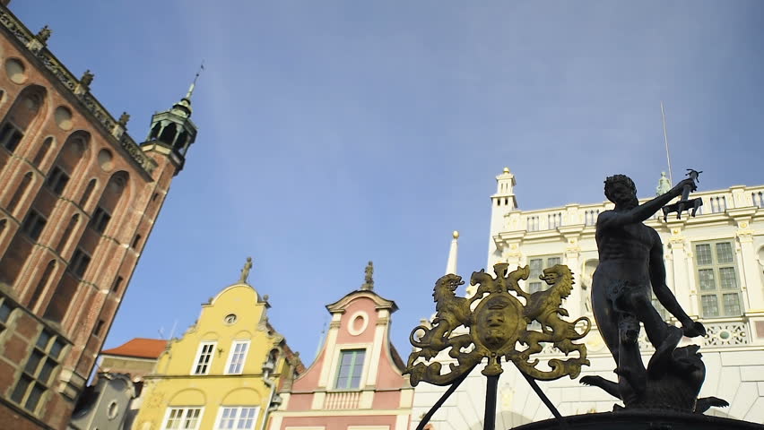 Slow slide with bronze Neptune statue in the old hansa town Gdansk, Poland