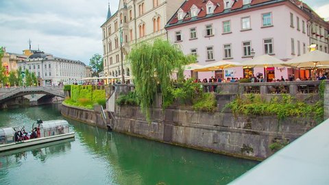 EVENTS IN LJUBLJANA JULIJ-AVGUST 2016 The city center of Ljubljana looks gorgeous in the summer time. The buildings are beautiful and a small boat with tourists is sailing on the river Ljubljanica.