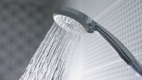 Water flow in the shower head. Slow motion stock footage