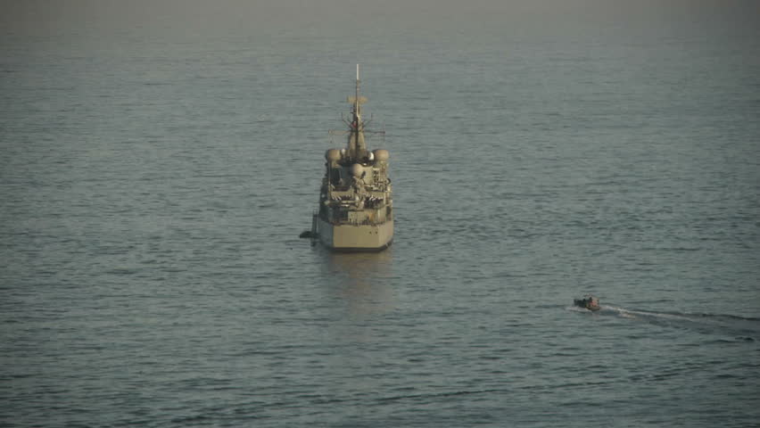 Small boat approaches Navy ship