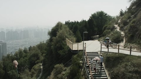 People walking up the stairs to Lanshan Mountain