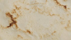 Ready to be filled and rolled tasty dessert surface 4K 2160p 30fps UltraHD footage - Close-up texture of pancake after being fried slow tilt 3840X2160 UHD tilting video