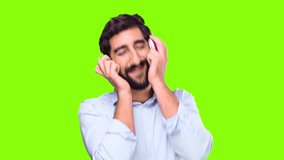 young crazy man with headphones on chroma key background