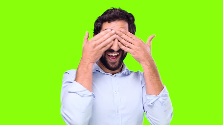 young crazy man covering eyes on chroma key background