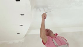 House painter rolling false ceiling 
