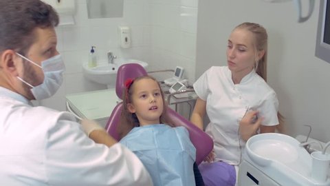 Dentist Examining a Patient