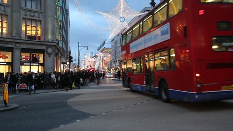 LONDON, UK - DECEMBER 27: Busses and other traffic drive beneath Christmas lights on Oxford Street on December 27, 2011 in London, UK. Oxford Street is one of the main shopping streets of London.