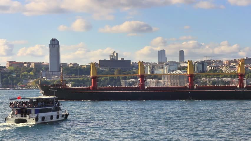 Bulk carrier ship and passenger ship passes in Bosporus Sea

