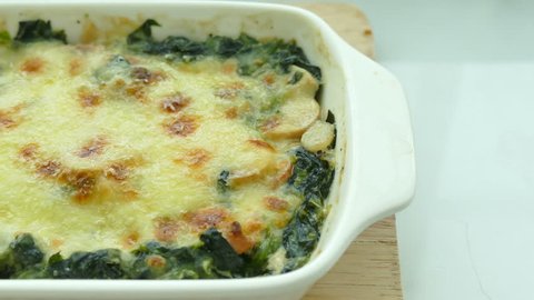 Spinach lasagna in white plate
