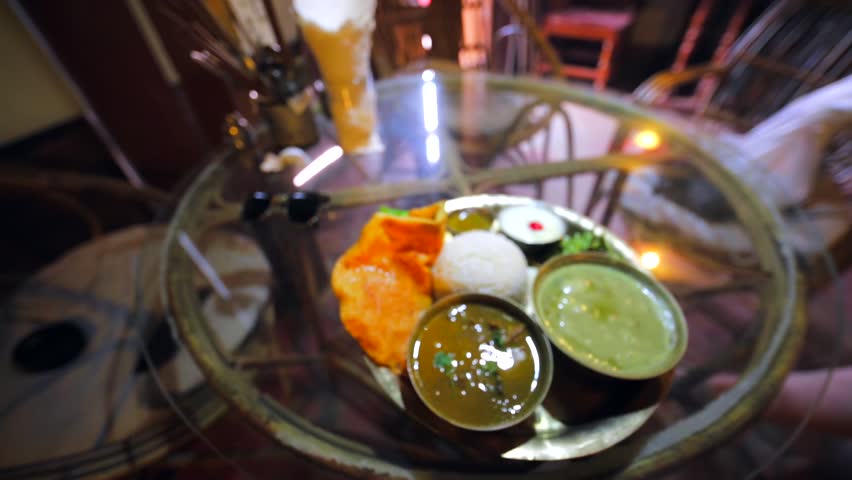 Dal Bhat, a traditional nepalese meal. It consists of steamed rice and a cooked lentil soup called dal. Bhat or Chawal means "boiled rice" in a number of Indo-Aryan languages.