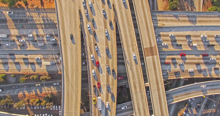 4K UHD vertical aerial top down view hyperlapse shot flying over heavy traffic on 10 freeway in Downtown, Los Angeles, California. 