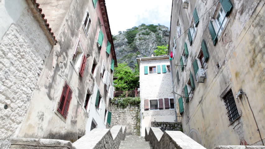 Stone staircase leads to entrances of living houses in old town of Kotor. Medieval fort inner area is a popular tourist place for visiting. Montenegro, Europe