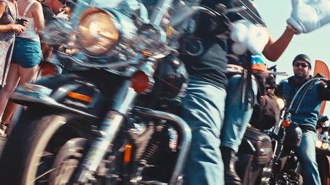 A group of bikers at a motorcycle parade out of focus in the end / Europe's biggest Harley Davidson event 6-11 September 2016 (Faaker See/AUT)
4K editorial footage